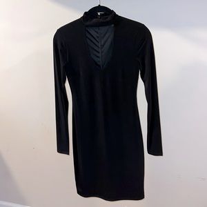 Mini, long sleeve black dress with V neck detail